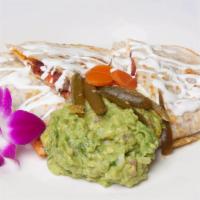 CHIPOTLE CHICKEN QUESADILLA · Chicken Tinga, monterey cheese, lettuce, pico de gallo, lime crema