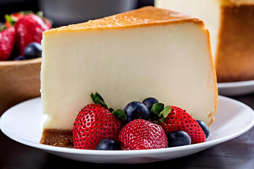 NY Cheesecake · Smooth and creamy cheesecake with graham cracker crust and fresh berries