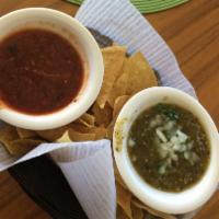 Chips and Salsa · Fresh tortilla chips with roasted tomato salsa.