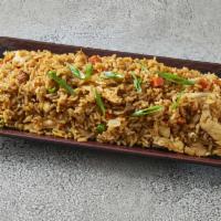 Fr1. Kow Pad · Fried rice. Stir fried rice with eggs, peas, carrots, and onions.