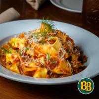 Papperdella and Bolognese · Papperdella pasta, homemade tomato sauce, prime beef ground, Parmigian cheese and basil.