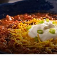 HOMEMADE CHILI  · Our Home-made Beef Chili served with Onions, Melted Cheddar and Sour Cream.