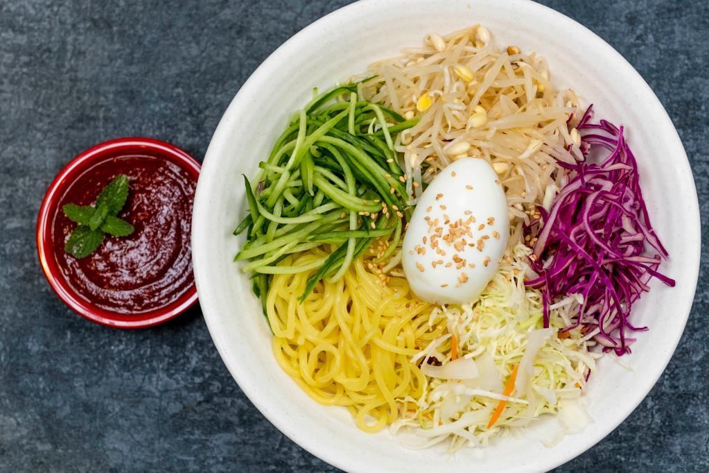 Jolmyun · Thick noodle, cucumber bean sprout, cabbage, red cabbage, egg, sesame, and sesame oil with hot sauce. Spicy.