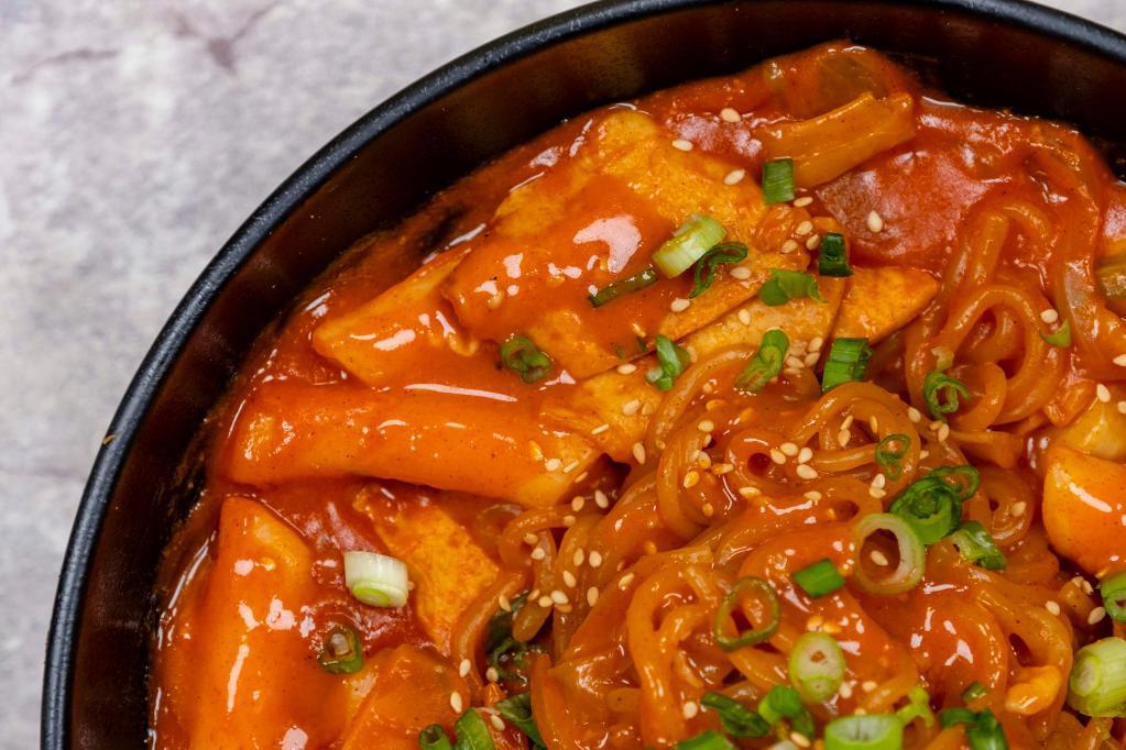 D3. Jolmyun Dukbokki · Rice cakes, thick noodle, fish cake, cabbage, carrot, scallions and sesame in hot sauce. Spicy.
