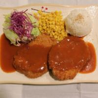 Kimgane Pork Cutlet · Pork cutlet, rice, lettuce, and corns with gravy sauce contains peanut.