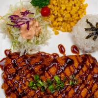 Japanese Pork Cutlet · Pork cutlet, rice, lettuce, and corns with teriyaki sauce.