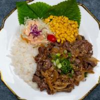 Beef Over Rice · Rice, beef, onion, scallion, sesame oil and sesame with soy sauce.