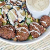 Falafel Bowl · Chopped salad, pickles, chickpeas, hard boiled egg, and hummus. Topped with tahini and hot s...