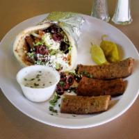 Gyro Sandwich · Gyro meat with lettuce, tomatoes, onion and pickles with cucumber sauce. Wrapped with hot pi...