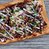 BBQ Chicken Flatbread · Grilled chicken, mozzarella, jalapenos, red onions, BBQ sauce and sour cream on the side.