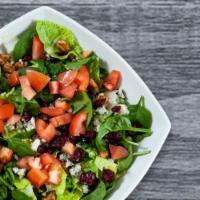 Signature Salad · Mixed greens, dried cranberries, fresh tomatoes, Gorgonzola, candied walnuts and raspberry w...