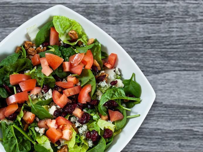 Signature Salad · Mixed greens, dried cranberries, fresh tomatoes, Gorgonzola, candied walnuts and raspberry walnut vinaigrette.