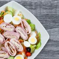 Chef Salad · Ham, turkey, provolone, hard-boiled eggs and Kalamata olives with pits over our tossed salad...
