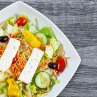Greek Salad · Feta, Kalamata olives with pits and pepperoncini peppers over our tossed salad without mozza...