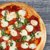 Margarita Pizza · Fresh mozzarella, pesto basil and our sauce.