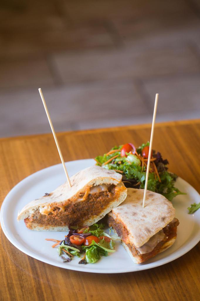 Polpette Panini Lunch · Housemade fresh bread toasted in our wood-burning oven, Meatballs in tomato sauce and provolone cheese with a choice of truffle potatoes chips or mix green salad on the side.