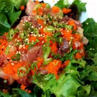 Sashimi Salad · Assorted sashimi over rice with vege and spicy sauce.
