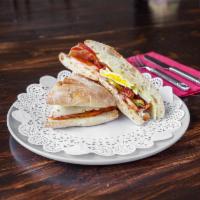 Beto's Breakfast Sandwich · Scrambled eggs, pepper jack, bacon, tomato, avocado, fresh basil, and spicy mayonnaise on to...