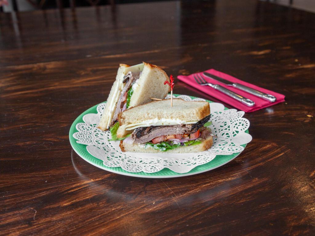 The Monte Diablo Sandwich · Roast beef, pepper jack cheese, bell peppers, lettuce, tomato, mayonnaise, Dijon mustard, and red onion on sliced sourdough.