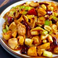 56. Kung Pao Chicken · Diced chicken meat with peanuts, onions, dry chili peppers and zucchini in our traditional k...