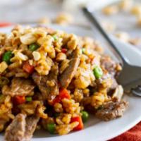 503. Beef Fried Rice · Stir fried with onions, eggs, peas and carrots.