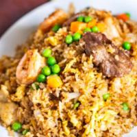 505. House Fried Rice · Shrimp, chicken and beef. Stir fried with onions, eggs, peas and carrots.