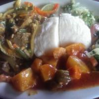 Curry Goat · This dish combines goat meat fused with cilantro, oregano and topped with mild curry sauce a...