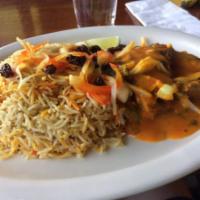 Fish Curry · Sauteed fish made with fresh cilantro coconut curry sauce served with bed of basmati rice.