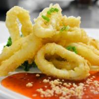Fried Calamari · Deep fried squid served with sweet and sour sauce. Served with dipping sauce.