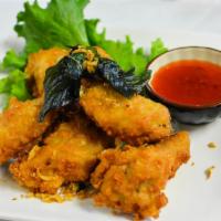 6 Piece Thai Chicken Wing · Fried chicken wing with special wing sauce. Served with dipping sauce.