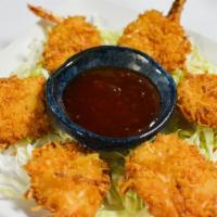 6 Piece Coconut Shrimp · Butterfly coconut shrimp served with sweet and sour sauce. Served with dipping sauce.
