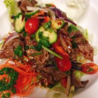 Thai Beef Salad · Sliced grilled beef, onion, scallion, cucumber, tomato, bell pepper and spicy chili lime sau...