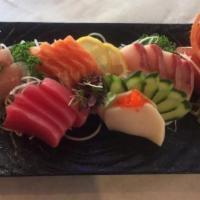 16 Piece Sashimi Premium · Raw fish sashimi chef choice. Served with miso soup and salad.