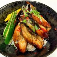 Unagi Don · Grilled eel served on bed of sushi rice with eel sauce.