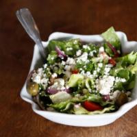 Traditional Greek Salad · Romaine, tomatoes, olives, feta and onion.