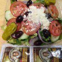 Greek Salad · Lettuce, tomatoes, onions, cucumbers, olives and feta cheese.