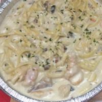 Fettuccine Alfredo with Chicken · Sauteed chicken, mushrooms, garlic in a creamy sauce and Parmesan cheese.