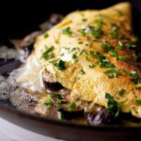 Mushroom Omelet · Three eggs and mushrooms. Served with a bagel with butter.