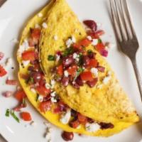 Greek Omelet · Tomato's and feta cheese.