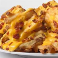Carol's Cheddar Bacon Fries · A house favorite waffle fries smothered in cheddar sauce and loaded with fresh bacon.