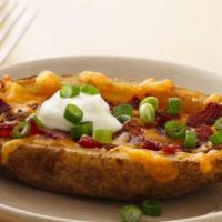 Loaded Potato Skins · Topped with cheese, bacon, and chives. Add protein for an additional charge. 