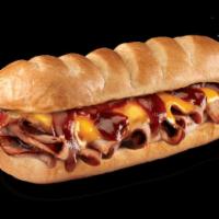 Smokehouse Beef & Cheddar Brisket Sub · USDA choice beef brisket smoked for 16 plus hours, cheddar, mayo, and Sweet Baby Ray's BBQ s...