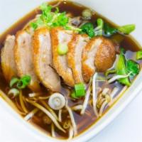 N8. Roasted Duck Noodles · Noodles with roasted duck and bean sprouts in brown spice soup