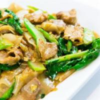 P4. Pad See Ew · Pan-fried flat rice noodles with your choice of meat, Chinese broccoli, egg, and black soy s...