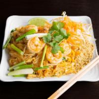 P5. Pad Thai · Pan-fried thin rice noodles with egg, bean sprouts, and green onions. Served with crushed pe...