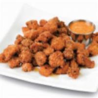 Popcorn Shrimp · Succulent shrimp marinated and coated in bread crumbs with a spicy mayo dipping sauce.