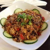 House Fried Rice · Fried rice, eggs, red bell pepper, onions, scallions, cooked with Soy Garlic sauce, topped w...