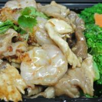 SF11. Garlic Sauce · Lots of garlic pepper sauce broccoli on cabbage served with rice.