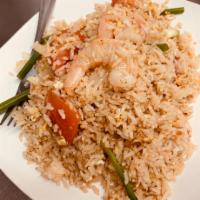 F1. Thai Style Fried Rice · Fried rice, egg, tomato, onion, scallions and cilantro with light brown sauce