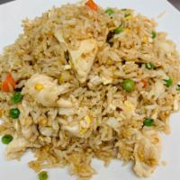 F2. Chinese Fried Rice · Fried rice, egg, pea and carrot with light brown sauce.